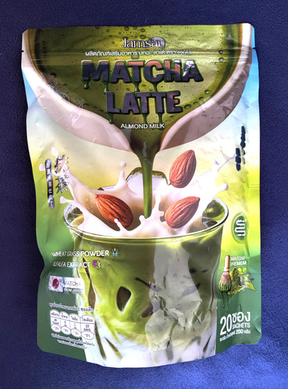 Packaging of Matcha Latte with almond milk on a blue background