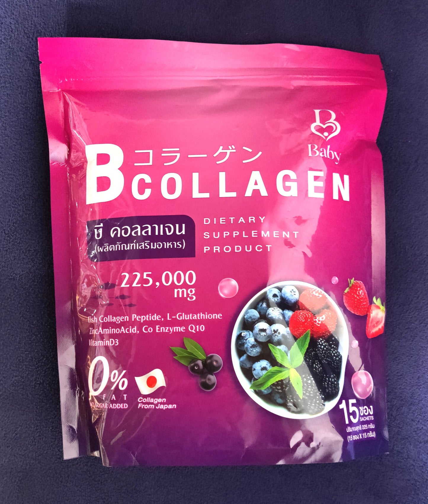 Pink package of B Collagen dietary supplement on a dark background