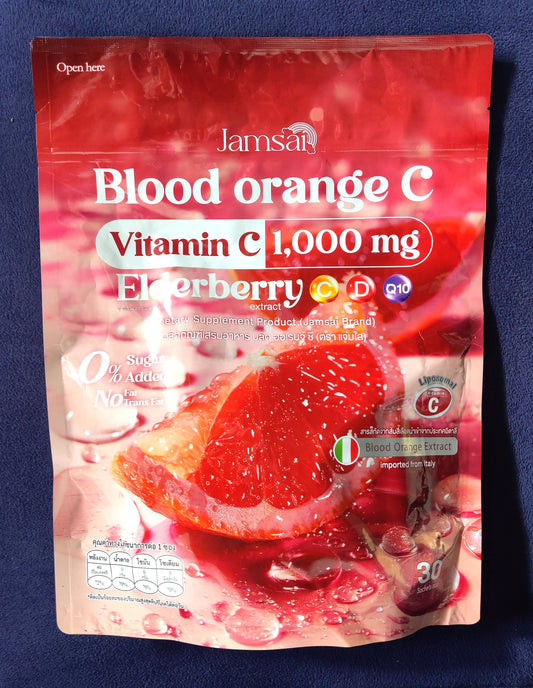 Vitamin C supplement package with blood orange flavor on a blue background
